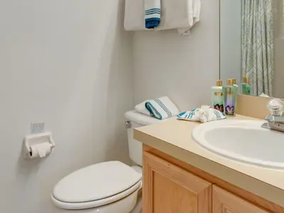 a bathroom with a white toilet and a sink at Holiday Home Luxuriöse 4-Bett-Villa in Disney by Interhome in Kissimmee
