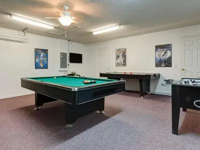a billiard room with two pool tables in it at Holiday Home Luxuriöse 4-Bett-Villa in Disney by Interhome in Kissimmee