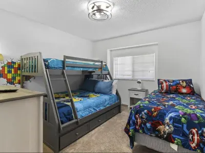 a bedroom with a bed and a bunk bed at Holiday Home Seasons Retreat mit privatem Pool in der Nähe von Disney by Interhome in Kissimmee