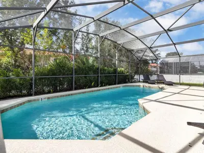 a large swimming pool with an open canopy over it at Holiday Home Seasons Retreat mit privatem Pool in der Nähe von Disney by Interhome in Kissimmee