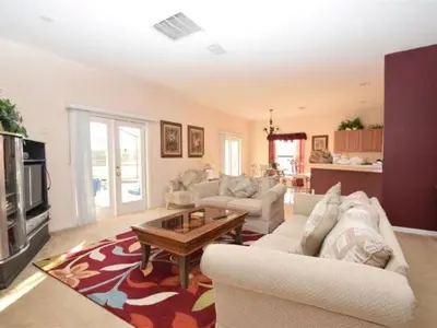 a living room with two couches and a coffee table at Holiday Home Villa Glenbrook Resort by Interhome in Orlando