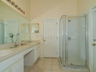 a bathroom with a shower and two sinks and a shower stall at Holiday Home Ruhige Glenbrook-Flucht in der Nähe von Disney by Interhome in Orlando