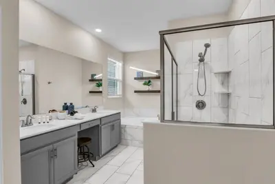 a white bathroom with a shower and a sink at Disney & Universal House with Pool & Arcade in Kissimmee