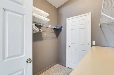 a walk in closet with a white door at Visit Disney and Universal Parks! Group-Friendly Gem in Orlando