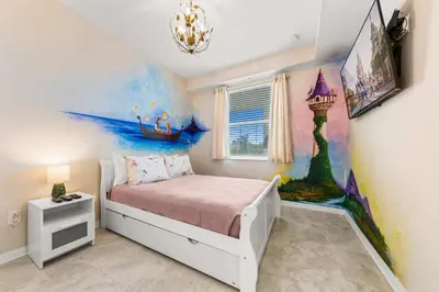 a bedroom with a bed with a painting on the wall at Mario & Fairy 3BR Condo w Free Water Park 303 in Kissimmee