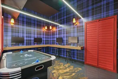 a room with a hot tub in a blue and red room at Kids Will Love! New Premium Theater & Theme Rooms villa in Orlando