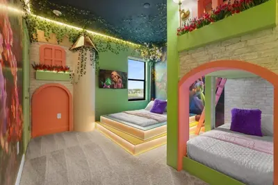 a bedroom with two beds in a house at Kids Will Love! New Premium Theater & Theme Rooms villa in Orlando