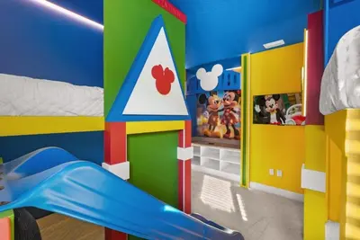 a childs bedroom with a play room with a toy house at Kids Will Love! New Premium Theater & Theme Rooms villa in Orlando