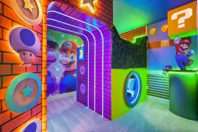 a room with a play room with a toy house at Kids Will Love! New Premium Theater & Theme Rooms villa in Orlando