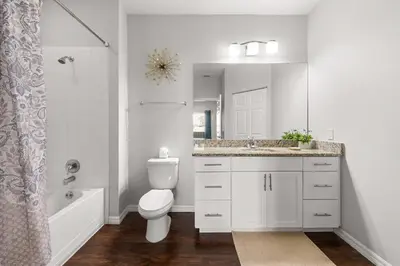 a bathroom with a toilet and a sink and a shower at Relaxing Resort Townhome Close to Disney in Kissimmee