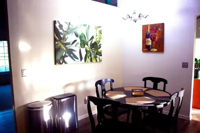 a dining room table and chairs in a room at 4 Bedroom Private Pool House - 5 Mi to Convention Center & 7 Mi to Disney in Orlando