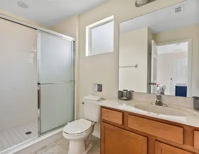 a bathroom with a toilet and a sink and a shower at Casa 6Q Bella Vida Resort – Perto Disney in Kissimmee