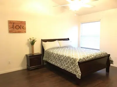 a bedroom with a bed and a window at 10 minutes to all Disney park for vacation in Kissimmee