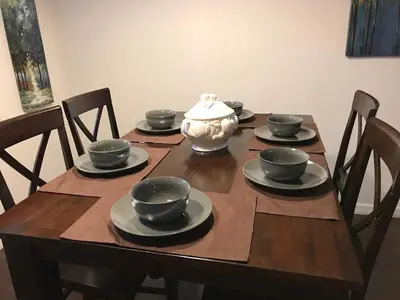 a wooden table with a vase on top of it at 10 minutes to all Disney park for vacation in Kissimmee