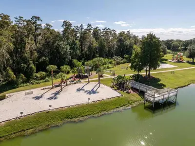 an aerial view of a park next to a river at Peaceful Palms Stay for 6 in Kissimmee