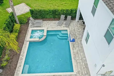 an overhead view of a swimming pool with lounge chairs at 160 Minton Loop in Orlando