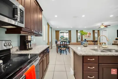 a kitchen with a sink and a stove top oven at 7503 Marker Avenue in Orlando