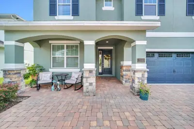 a house with a patio with a dog sitting on it at 7503 Marker Avenue in Orlando