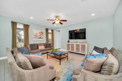 a living room with two couches and a tv at 7503 Marker Avenue in Orlando
