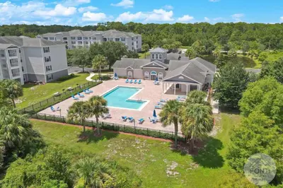an aerial view of a resort property with a swimming pool at 3176-205 Resort Pool Condo Apt near Disney in Kissimmee