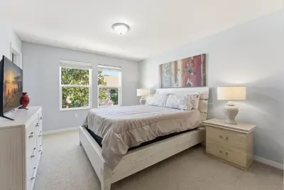 a bedroom with a bed and a window at Savvy 4Bed Stay Near Orlando Attractions in Kissimmee