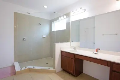a bathroom with a shower and a sink at Spacious Home - Veranda Palms w Heated Pool & BBQ in Kissimmee