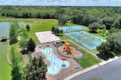 an aerial view of a park with two pools at 4 Bedroom 3 Bathroom Villas At Seven Dwarfs 24-101 in Kissimmee