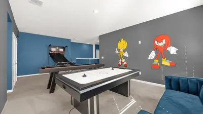 a room with a ping pong table and a ping pong table at Upstay Spacious Villa w Pool, Hot Tub & Game Room in Kissimmee