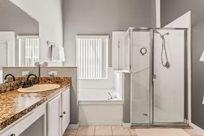 a bathroom with a shower and a sink at The Art House Home for 8 in Orlando