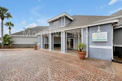 a house with a driveway in front of it at Mickey Family Condo - 4 Miles to Disney in Orlando
