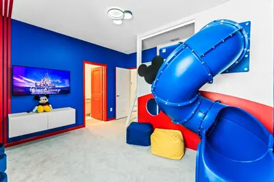 a childs room with a inflatable slide at Ev2440 - Orlando Luxe Retreat in Kissimmee