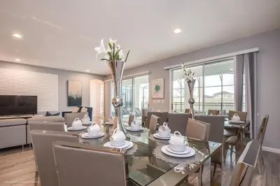 a dining room with a table and chairs at Ev2619 - Sonoma Retreat in Kissimmee