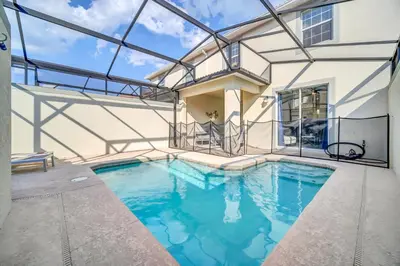 a swimming pool in a house with a glass ceiling at Ev4829 - Lullaby Oasis in Kissimmee