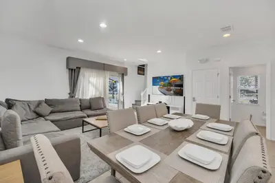 a living room with a table and a couch at Ev30360 - Encantada Villa in Kissimmee