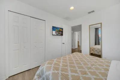 a bedroom with white walls and a large white closet at Ev30360 - Encantada Villa in Kissimmee