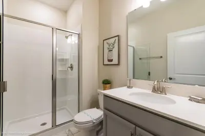 a bathroom with a shower and a sink and a toilet at Ev4958 - Sunset Cove Villa in Kissimmee