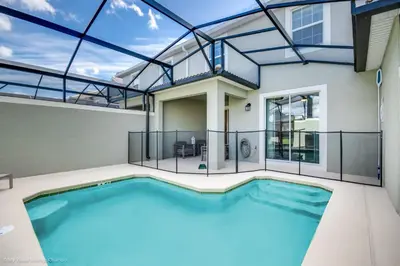 a swimming pool in a house with a glass ceiling at Ev4958 - Sunset Cove Villa in Kissimmee