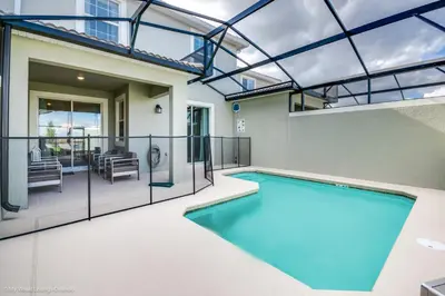 a swimming pool in a house with a glass ceiling at Ev4958 - Sunset Cove Villa in Kissimmee