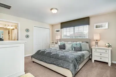 a bedroom with a large bed and a window at Ev8944 - Paradise Palms Escape in Kissimmee