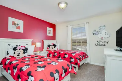 two beds in a bedroom with red walls at Ev8944 - Paradise Palms Escape in Kissimmee