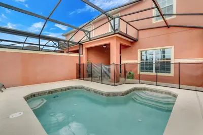 a swimming pool in a house with a building at Ev8944 - Paradise Palms Escape in Kissimmee