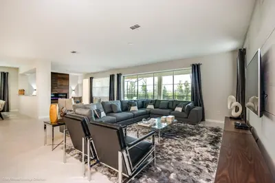 a living room with a couch and a table at Ev9043 - Solara Prestige Villa in Orlando
