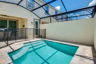 a swimming pool in a house with a glass ceiling at Ev1542 - Solara Luxe in Orlando