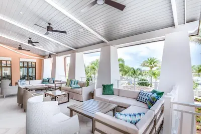 an outdoor living room with couches and tables at Ev1542 - Solara Luxe in Orlando