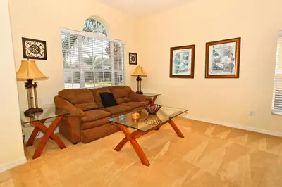 a living room with a couch and a table at Ev1915 - Sunset Glen Villa in Orlando