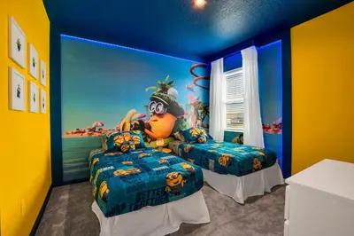 a bedroom with two beds with a disney mural at Ev2395 - Grand Haven Retreat in Kissimmee