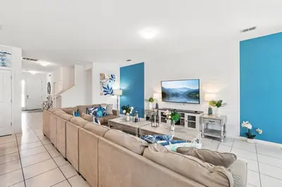 a large living room with couches and a tv at Ev2576 - Lakeside Adventure Villa in Kissimmee