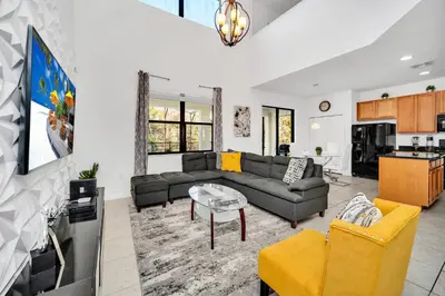 a living room with a couch and a table at Ev2628 - Veranda Palms Hideaway in Kissimmee