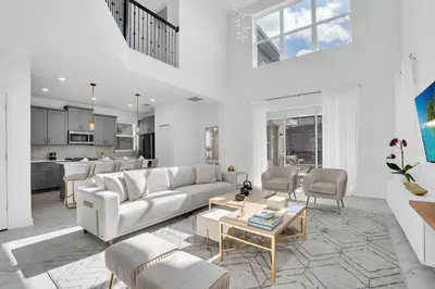 a living room with a couch and a table at Ev2669 - Sunshine Escape Villa in Kissimmee