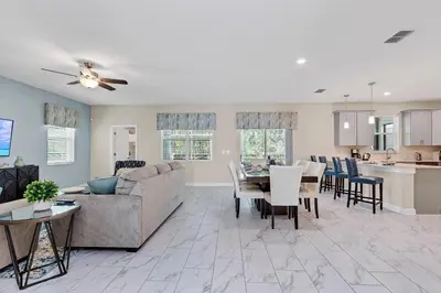 a living room with a couch and a table at Ev2707 - Magic Getaway Villa in Kissimmee